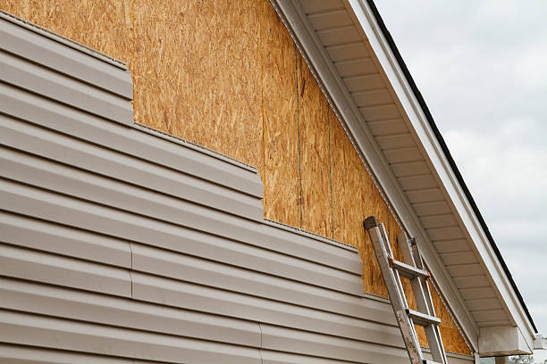 Professional Storm Damage Siding Repair technician working in Bloomingdale, OH